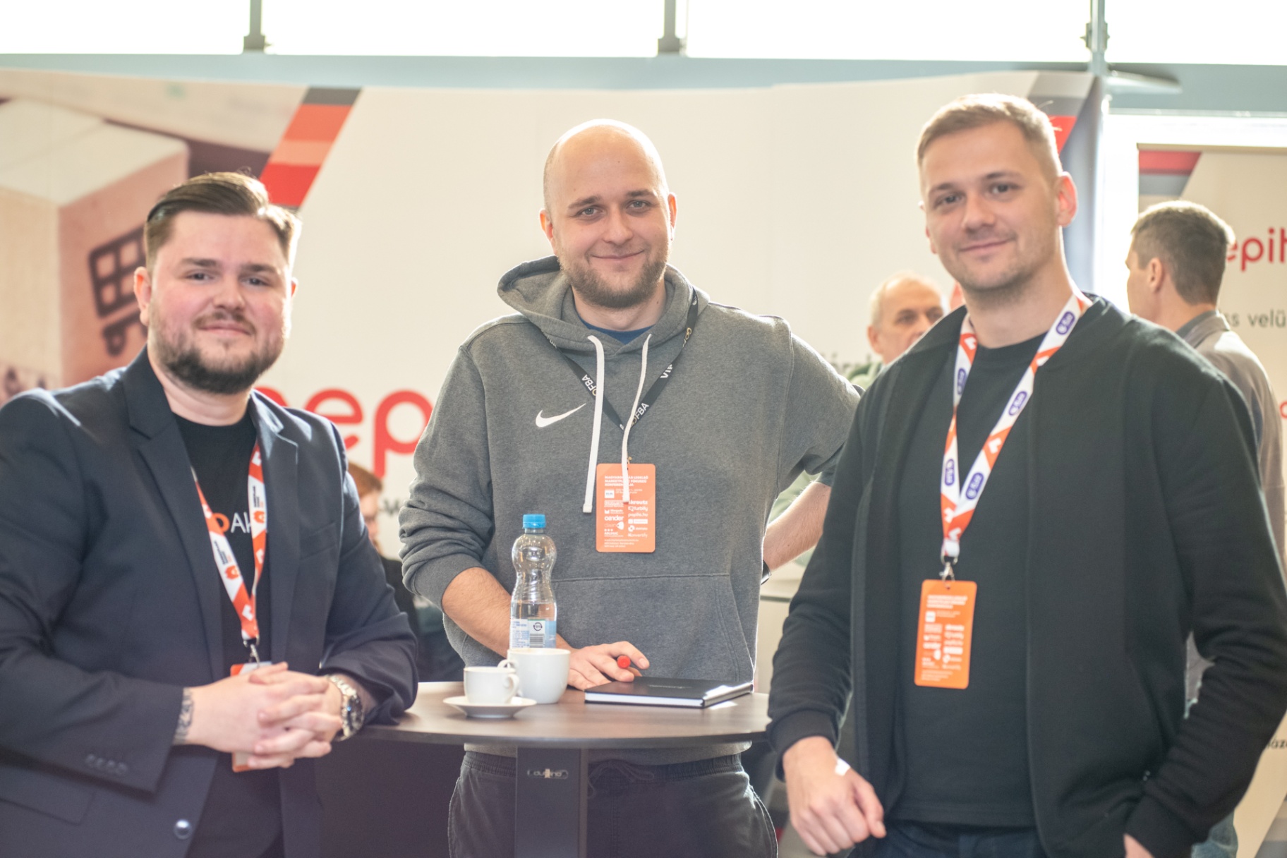 Three attendees at the Pepita stand