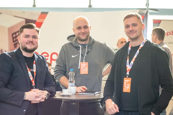 Three attendees at the Pepita stand
