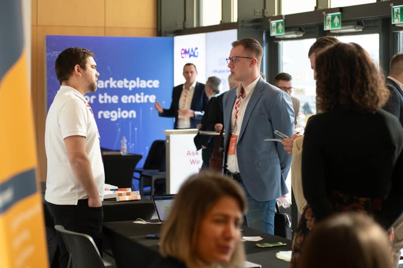 Attendees at a marketplace partner stand at a previous edition